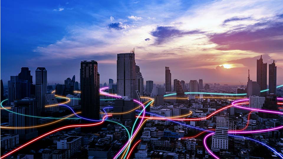 Visual of internet connectivity across a large city with neon lines depicting network connections